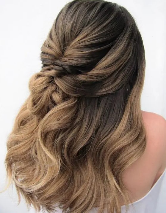 a beautiful dimensional wedding half updo with a bump on top and some waves down is a cool idea for a girl with long hair