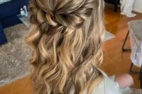 a beautiful long and wavy half updo with a bump on top and a twisted halo plus some waves down is amazing for a wedding