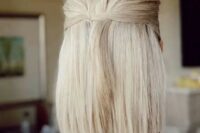 a blonde medium length half updo with a textured top and straight hair down is great for a minimalist bride