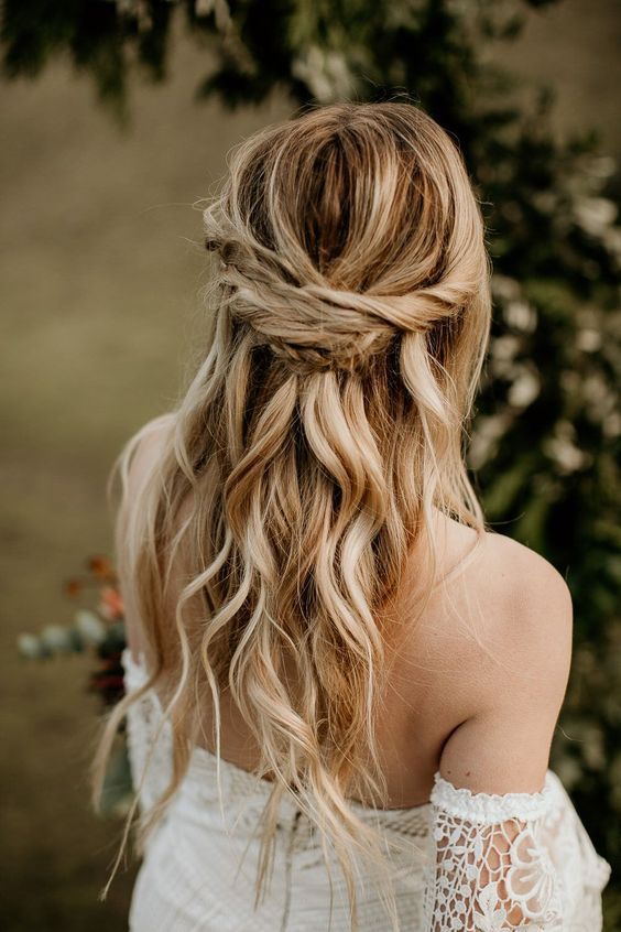 a boho half updo with a twisted and braided touch and waves down will fit a bride or a bridesmaid