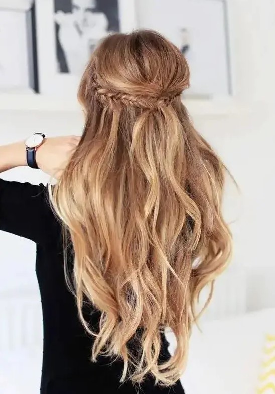 a braided half updo with light waves on long hair is a great idea for many styles