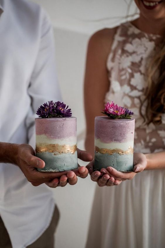 a duo of pastel lilac and green wedding mini cakes topped with blooms are amazing for a small wedding