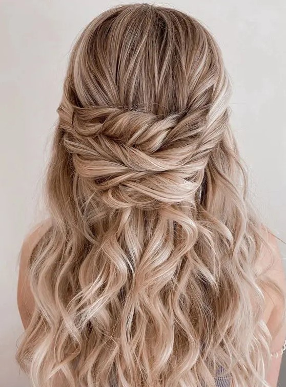 a gorgeous wavy and textured triple twisted wedding half updo is amazing for weddings, it's perfect for long hair