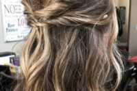 a long and wavy double twisted half updo with a bump on top and pretty balayage is a cool idea for a wedding, it looks chic and lovely