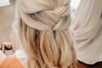 a lovely blonde half updo with a couple of twists and wavy ends is a beautiful idea that will work for many styles