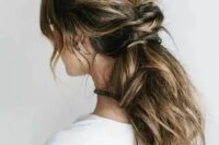 a messy low ponytail with a twisted part and some locks down is idea for hair with lowlights, a comfy modern hairstyle