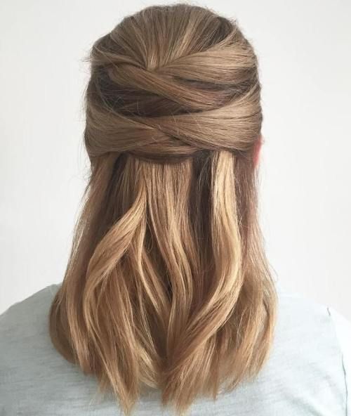 a modern half updo with a double twisted element and lamost straight hair down is a cool idea