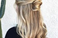a simple and quick half updo with a bump, a messy top knot and almost straight hair down is cool