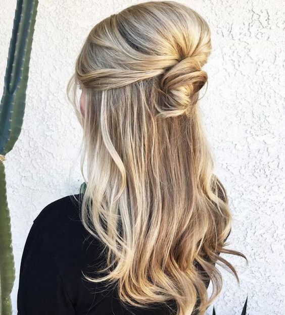 a simple and quick half updo with a bump, a messy top knot and almost straight hair down is cool
