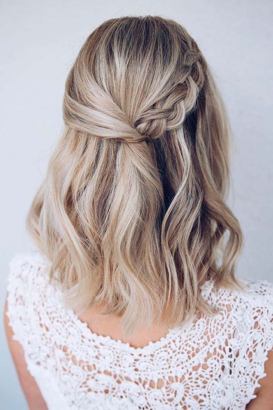 a super cool boho half updo with a sleek top, a braid on one side and waves down is ideal for both medium and long hair
