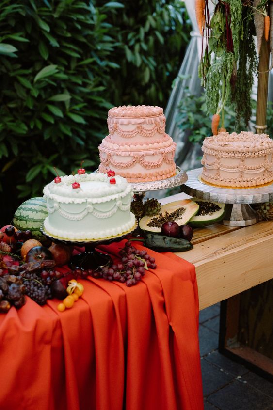 an arrangement of blush and mint green lambeth wedding cakes with lots of details is amazing