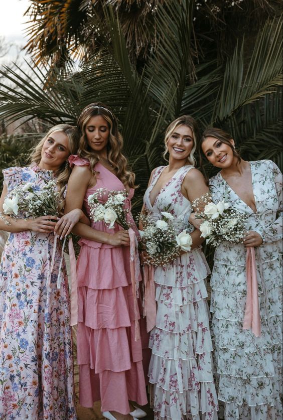 beautiful mismatching neutral floral and a pink ruffle bridesmaid dresses for a glam and feminine look