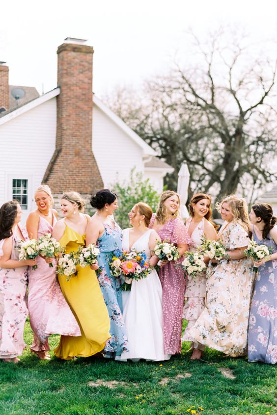 colorful and pastel floral maxi bridesmaid dresses with straps and sleeves, with shoes for a summer wedding