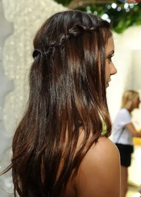 dark brown hair with caramel balayage and a braided halo is a very chic and cool idea for a boho or rustic look