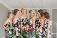 dark floral cold shoulder maxi bridesmaid dresses with ruffles are a chic and non-typical idea for a tropical wedding