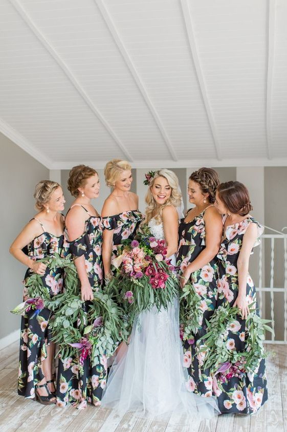 dark floral cold shoulder maxi bridesmaid dresses with ruffles are a chic and non-typical idea for a tropical wedding