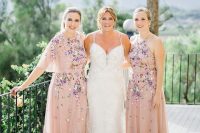 delicate and beautiful blush maxi bridesmaid dresses with lovely and bold floral embroidery are amazing