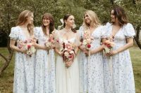 lovely blue and white floral print midi bridesmaid dresses with deep necklines, puff sleeves and white shoes for a garden wedding