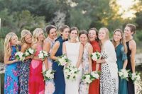 lovely colorful and printed midi bridesmaid dresses with mismatching designs and mismatching shoes for a bold look