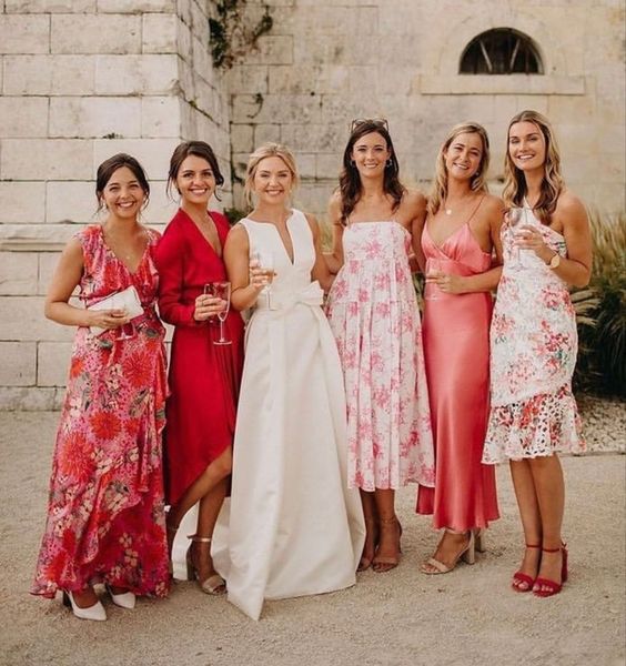 mix and match red and pink plain and floral knee and maxi bridesmaid dresses are a great idea for a pink and red wedding