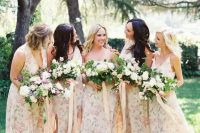 subtle mismatched watercolor floral print bridesmaids’ dresses with various cuts and necklines for a spring wedding