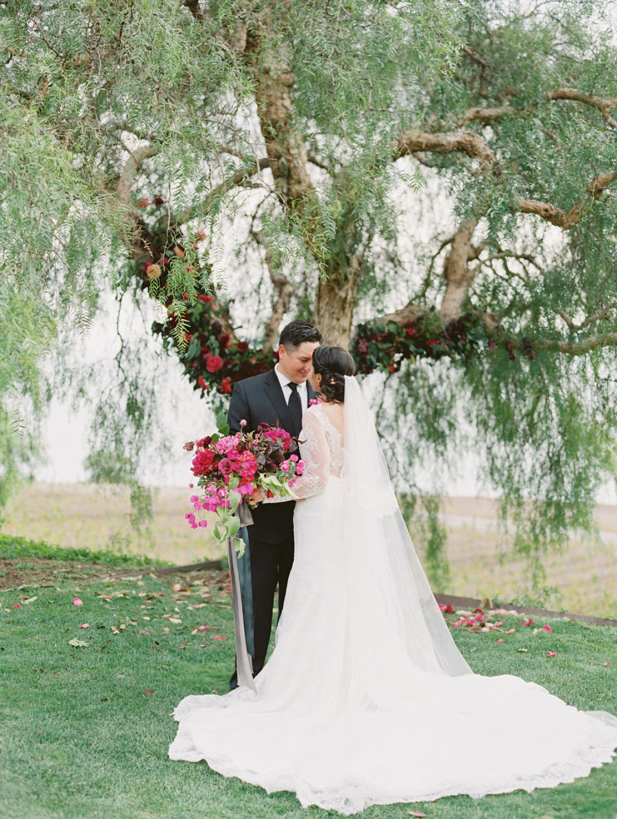 This beautiful wedding at a vineyard was done with rich colors and some black touches for drama