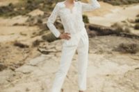 02 a bridal jumpsuit with a lace bodice and long sleeves and plain pants plus metallic heels