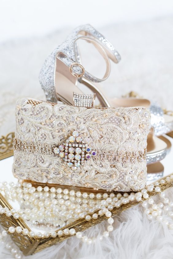 silver glitter shoes and a lace embellished wedding clutch with a lot of bling for a glam feel