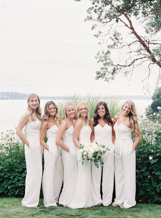strapless white jumpsuits with a geometric neckline is a trendy and chic choice for a modern wedding