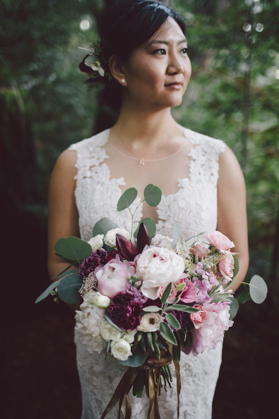 Her bouquet was done with light pink, blush and purple blooms and greenery that were also seen in the bouquet