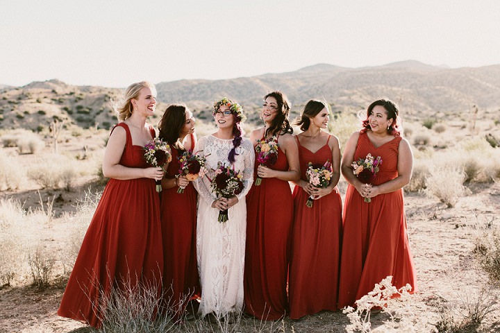 The bridesmaids were wearing rust-colored mismatched dresses, the bride was rocking a wedding gown by Grace Loves Grace
