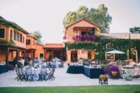 03 The wedding reception space was done with lush greenery and fuchsia flowers, with tables with tablecloths of lavender and navy shade