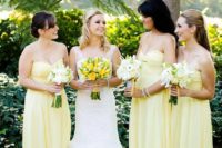 03 bridesmaids wearing light yellow spaghtti strap gowns and carrying white bouquets