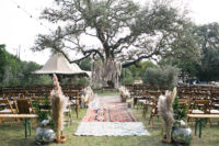 04 The ceremony space was done with pampas grass, boho rugs and fresh greenery, pampas grass is one of the trends