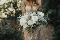 04 The wedding bouquet was done in creamy tones with greenery to make the dress stand out