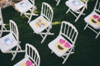 04 There were fun and colorful emoji props on the guests’ chairs to make the wedding exit unforgettable