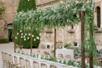 04 add a more intense garden feel to the reception with greenery over the table and a matching runner