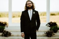05 The groom was wearing a tailored suit with a bolo tie and glasses, he looked rather boho chic