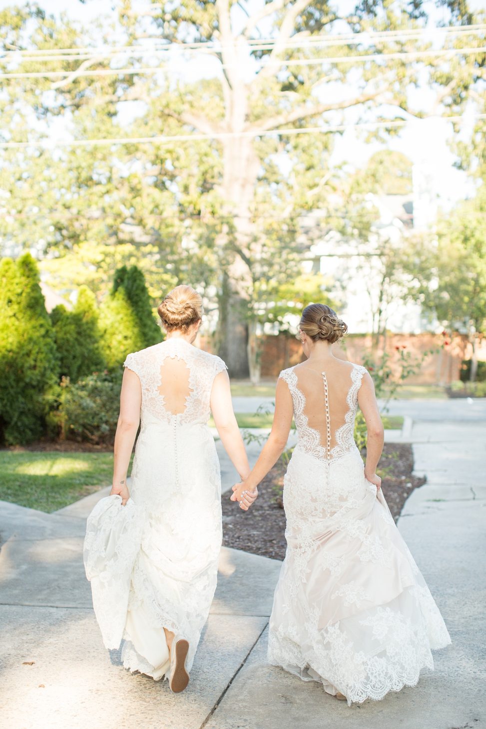 The second bride was rocking a sleeveless cap wedding dress with a cutout back