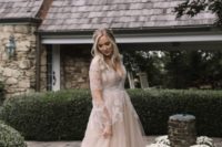 05 a blush wedding gown with white lace appliques, illusion sleeves and a deep V-neckline