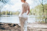 05 a chic bridal jumpsuit with a lace bodice on buttons and long sleeves and plain slik pants, high heels for a romantic feel