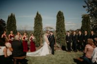07 The bridesmaids were wearign burgundy maxi dresses, and the groomsmen were wearing black suits with burgundy ties