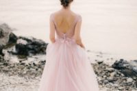 07 a delicate light pink wedding dress with a lace bodice, an open back on buttons and a light tulle full skirt