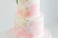 07 a pink watercolor wedding cake with gold leaf topped with pink blooms for a garden wedding