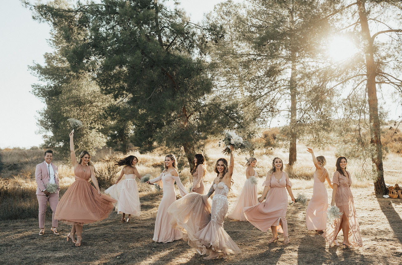 The bridesmaids were rocking mismatching dresses in blush and dusty pink tones