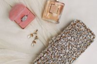 08 a glam fully embellished wedding clutch will add a glam touch to the bridal look