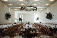 09 The wedding venue was a white and serene one, done with greenry touches – centerpieces and chandeliers
