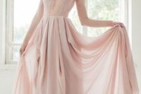 09 a dusty pink wedding gown with a lace bodice, an illusion plunging neckline, long sleeves and a layered skirt