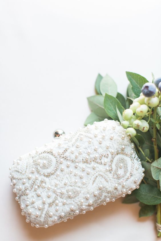 a gorgeous embellished sequin, beads and pearls wedding clutch is a masterpiece to complete your look