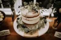 10 The wedding cake was a naked one topped with fresh eucalyptus